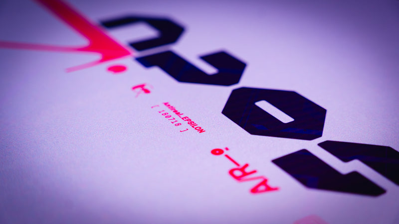 Close-up of a printed document with text and logos on a purple background