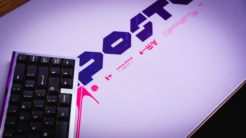 Keyboard on a white surface with a colorful logo in the background