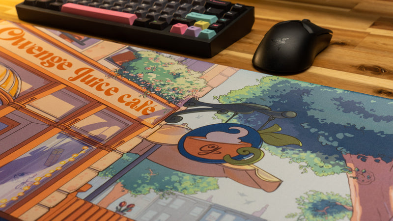 "The OwengeJuice Cafe" — OwengeJuice Deskmat