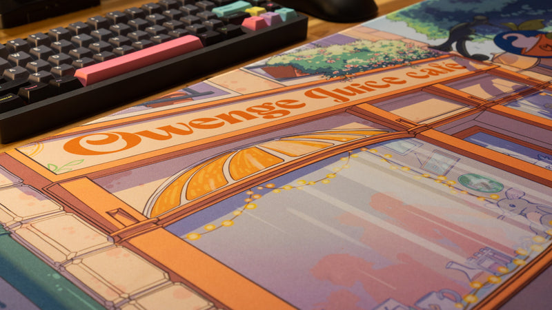 "The OwengeJuice Cafe" — OwengeJuice Deskmat