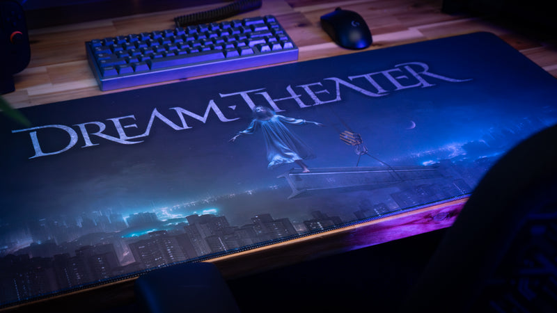 Large 'Dream Theater' branded mouse pad with keyboard and mouse on a desk