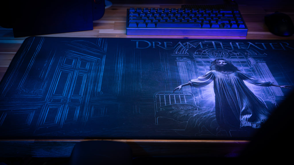 Gaming desk setup with a 'Dark Souls' themed mouse pad and keyboard.