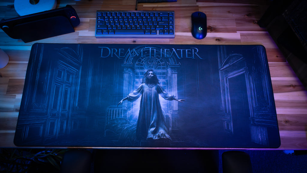 Dream Theater mouse pad on a desk with keyboard and mouse