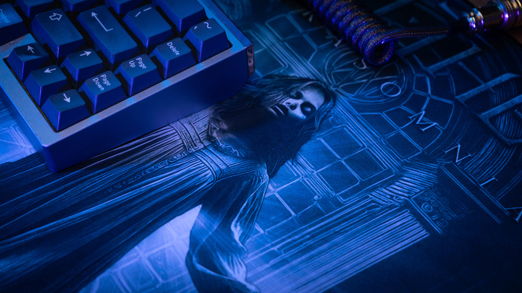 Blue-lit keyboard with a figurine on a mystical map
