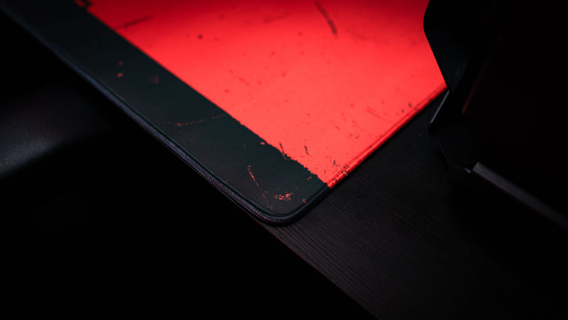 Stitching close-up of a red oil rig desk mat