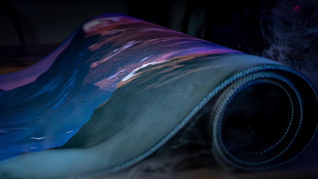 Roll of colorful fabric with abstract patterns on a dark background