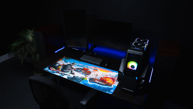 A Solo's Kingdom gaming deskmat by Gorliac displayed on an RGB gaming battlestation with dual monitors, mechanical keyboard, and desktop PC.