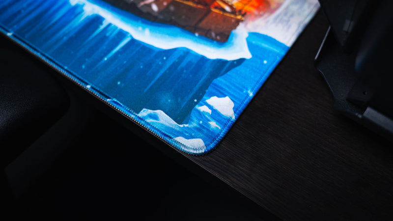 Close-up of the A Solo's Kingdom gaming deskmat by Gorliac showcasing premium stitched edges and the icy shoreline artwork.