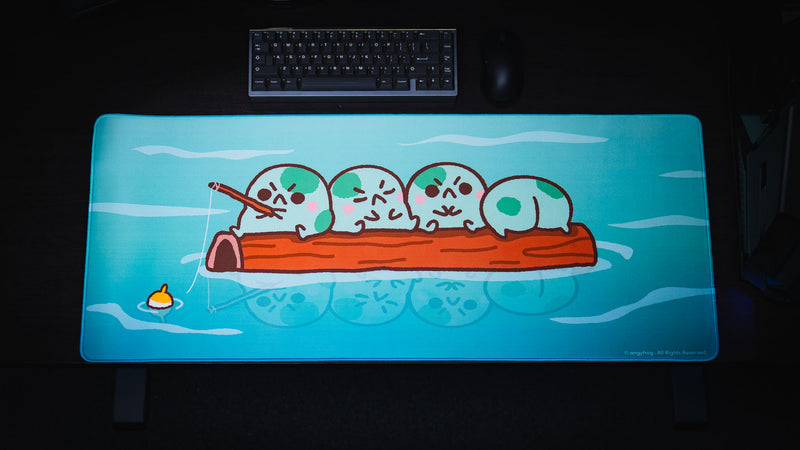Overhead desk setup with keyboard and mouse above the blue Angyfrog Frogs on a Log desk mat