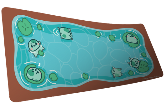 Angyfrog The Pond desk mat artwork with small frogs, lily pads, blue water, and a warm brown border
