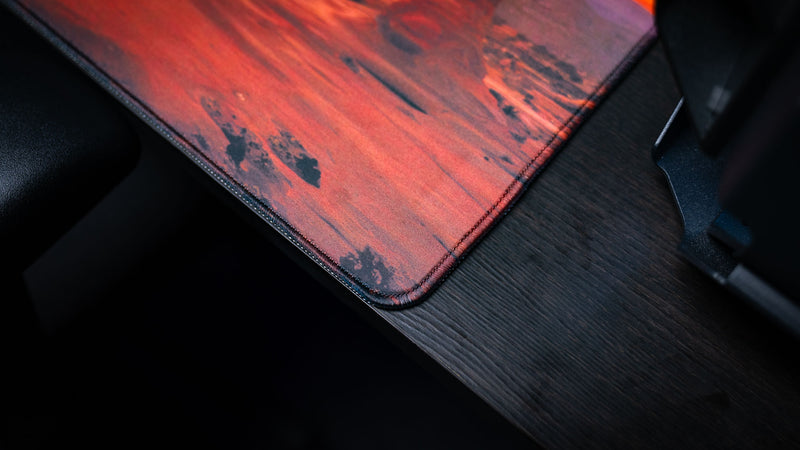 Close-up of the Arches National Park premium deskmat highlighting precision stitched edges, durable construction, and a smooth high-definition cloth surface.