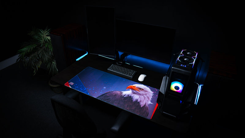 Bald Eagle Blue deskmat featuring a bald eagle, blue starry background, America 250 branding, and red accent corners.