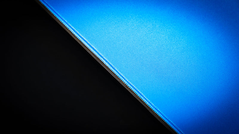 Close-up detail of the Bald Eagle in Flight deskmat showcasing the premium stitched edge and smooth fabric surface with a vibrant blue sky design from the America 250 collection.