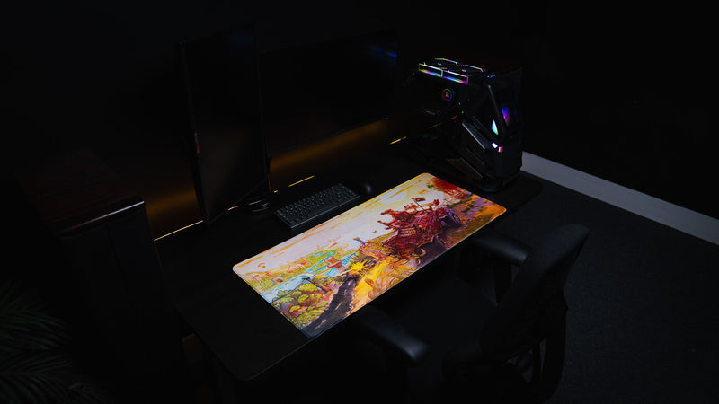 Wide view of Beastmode’s Rust After Glory desk mat across a dark gaming desk with monitor and RGB PC