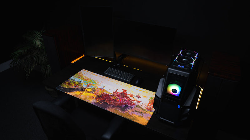 Beastmode’s Rust After Glory desk mat in a dark RGB gaming setup with dual monitors and a desktop PC