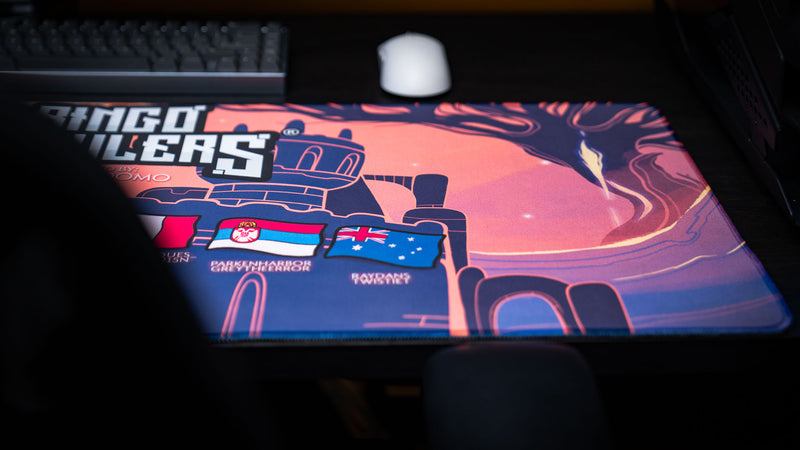 Close-up view of the Bingo Brawlers Season 6 Commemorative Deskmat featuring castle artwork, player flags, and fantasy landscape details.