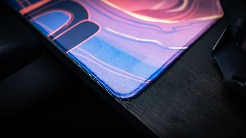 Close-up of the stitched edge and premium fabric surface on the Bingo Brawlers Season 6 Commemorative Deskmat.