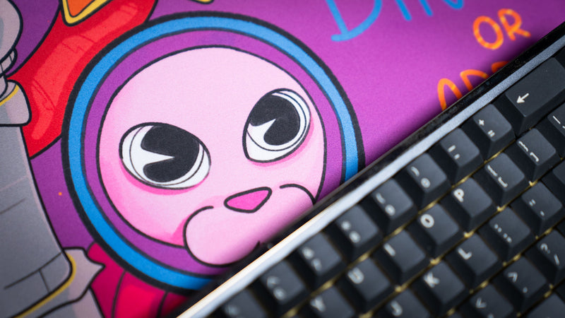 Detailed Bingus character close-up from the Bingus Bongus deskmat displaying crisp artwork, smooth fabric texture, and vivid colors.