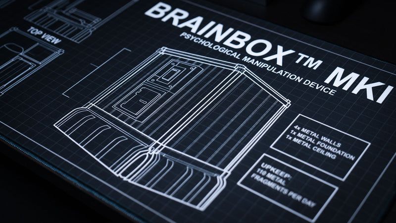 Angled view of the BRAINBOX MK1 deskmat featuring a Rust metal base blueprint, technical schematics, and engineering-inspired design details.