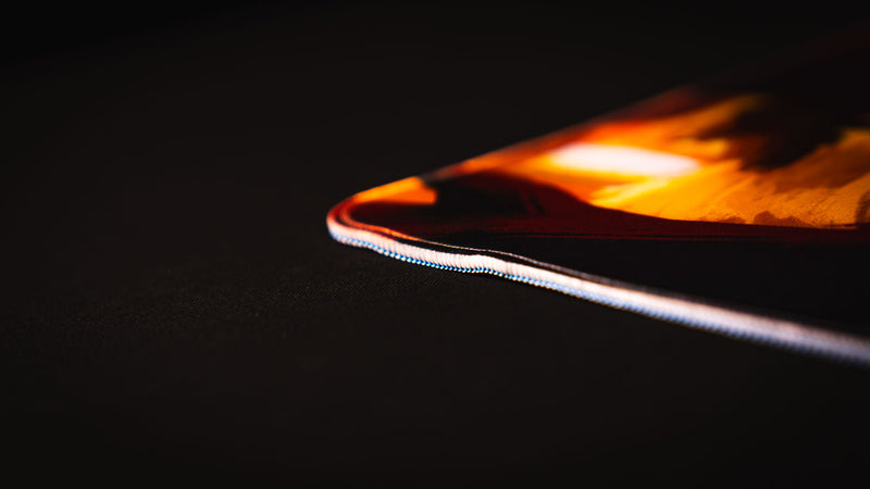 Low-angle close-up of the Bubbles Playmat’s reinforced stitched edge and layered construction