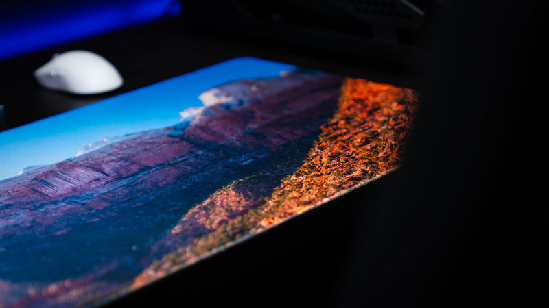 Close-up of the Canyon Junction deskmat highlighting Zion National Park's rugged sandstone cliffs, vibrant HD landscape photography, premium stitched edges, and smooth gaming surface.
