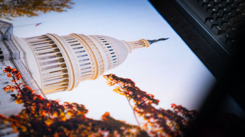 Close-up of the Capitol Building deskmat highlighting the iconic United States Capitol dome with vibrant autumn foliage and premium high-definition print quality.