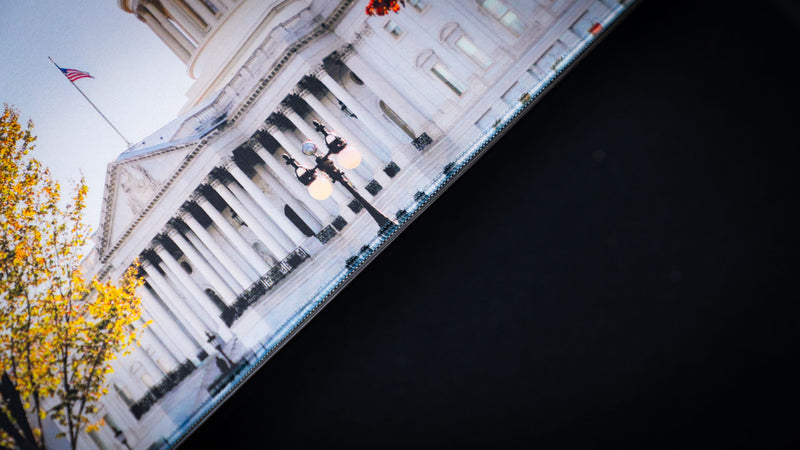 Close-up detail of the Capitol Building deskmat highlighting the U.S. Capitol facade, premium stitched edge, and high-definition print quality on an extended mouse pad.
