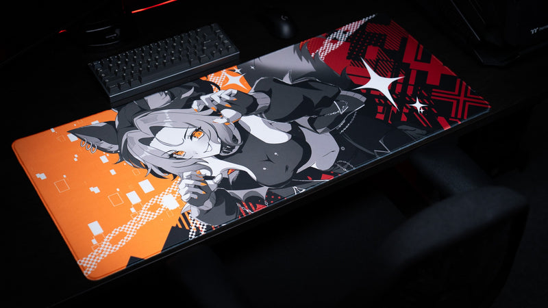 Angled left view of the CelisEris Brand Risk gaming deskmat on a dark computer desk