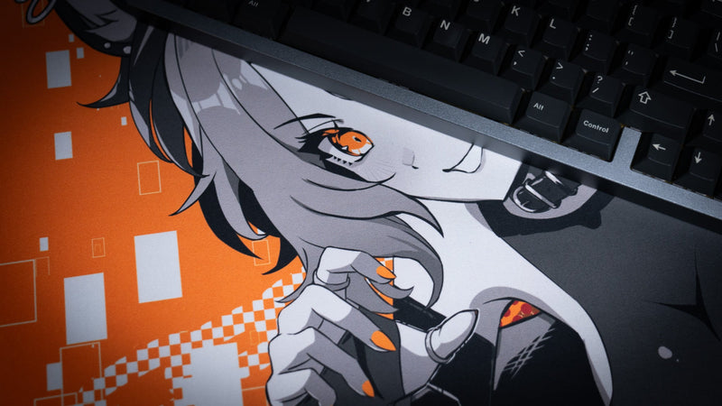 Close-up of CelisEris Brand Risk deskmat artwork beneath a mechanical keyboard