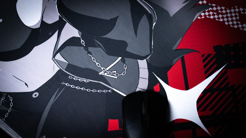 Close-up of a mouse on the red and black CelisEris Brand Risk gaming deskmat