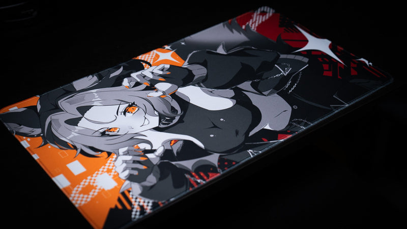 Angled left view of the CelisEris Brand Risk TCG playmat on a dark tabletop
