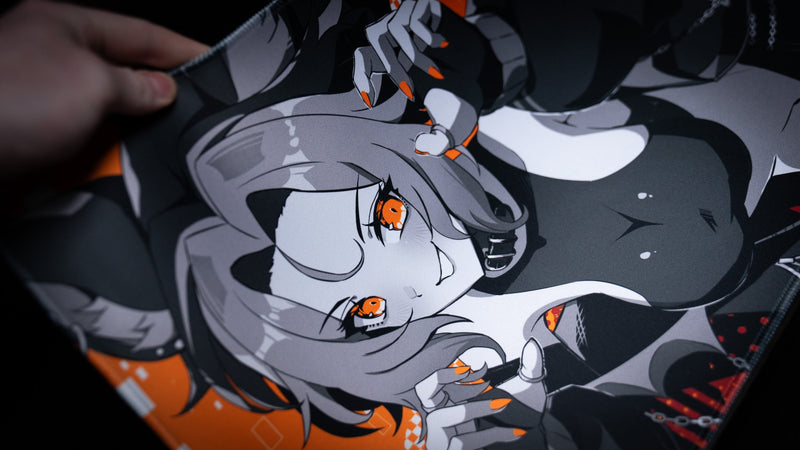 Close-up of orange-eyed wolf character artwork on the CelisEris Brand Risk TCG playmat