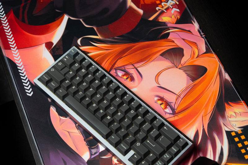Close-up of a keyboard on the CelisEris Firewolf deskmat and orange-haired character artwork