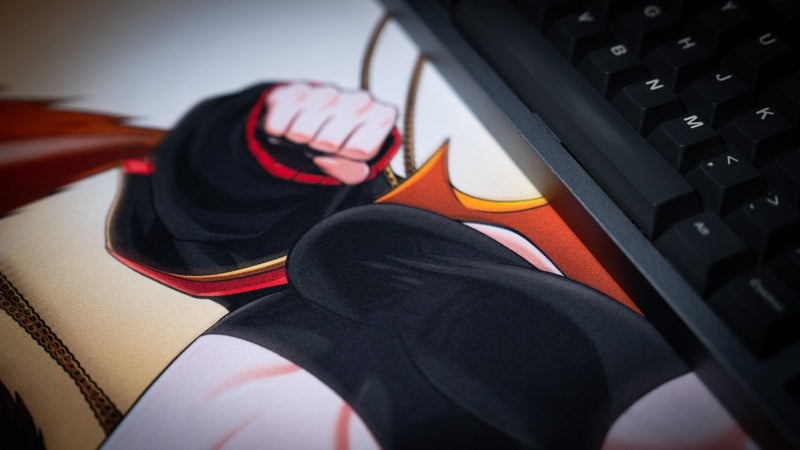 CelisEris Martial deskmat surface and character artwork beside a keyboard