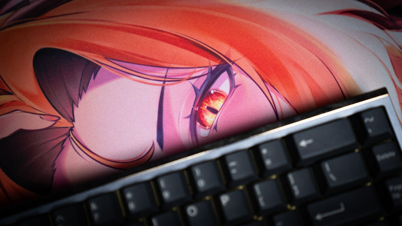 Close-up of a mechanical keyboard over the CelisEris Spectral Wolf gaming deskmat artwork