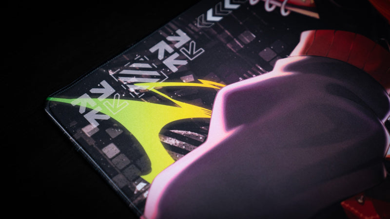 Close-up of neon green graphics and character artwork on the CelisEris Spectral Wolf deskmat