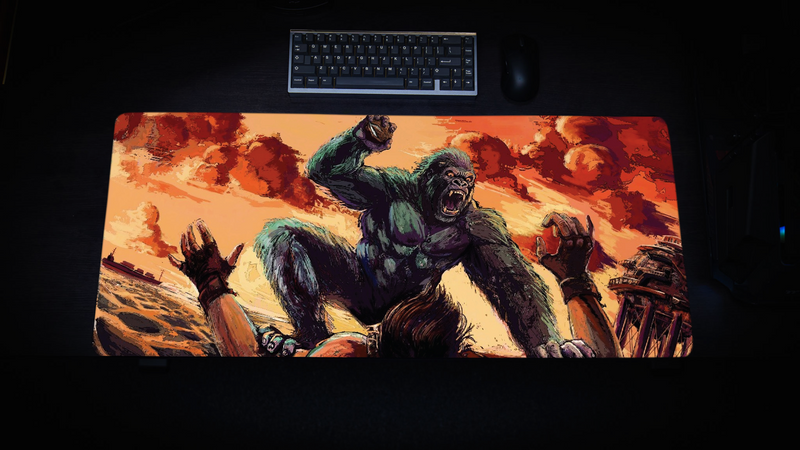 CocoKong gaming deskmat by CoconutB featuring a raging gorilla attacking a stranded survivor on a Rust-inspired beach with Oil Rig in the background.