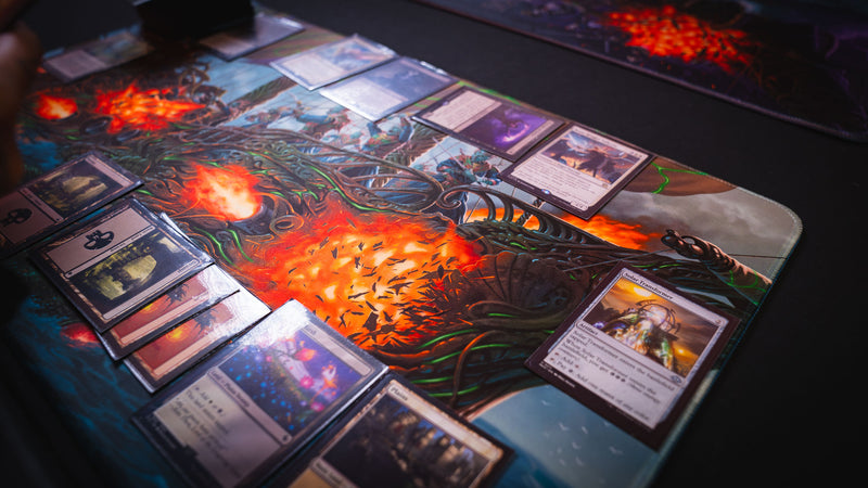 Close-up of a live trading card game on the Coralborn playmat, featuring detailed fantasy sea battle artwork, vivid colors, premium stitched edges, and ample space for competitive TCG gameplay.