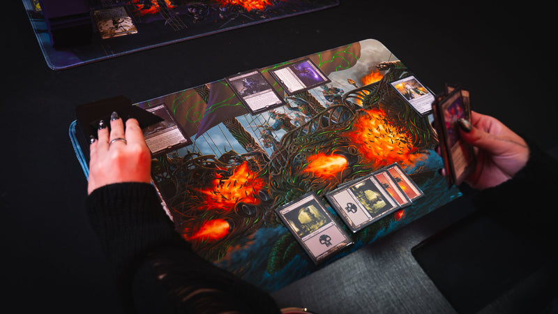 Players using the Coralborn TCG playmat during a card game, showcasing the vibrant fantasy naval battle artwork, premium stitched edges, and spacious tournament-ready play surface.