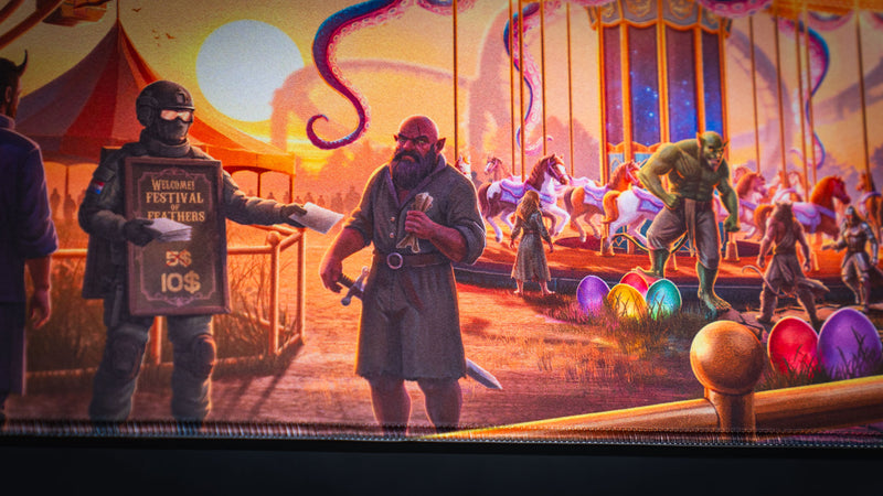 Carnival carousel and masked festival characters on the Crowmedia Festival of Feathers deskmat
