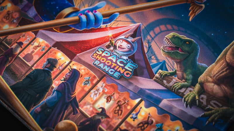 Dinosaur and Space Shooting Range carnival detail on the Crowmedia Festival of Feathers deskmat