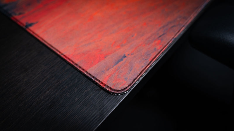 Close-up of the Delicate Arch premium deskmat corner showcasing precision stitched edges, durable construction, and high-definition Arches National Park artwork.