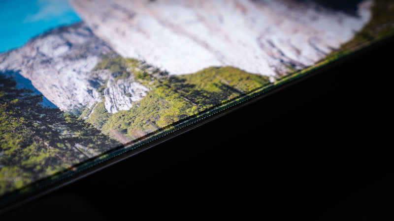 Close-up of the El Capitan deskmat highlighting Yosemite National Park's forested valley, premium stitched edges, detailed HD photography, and durable gaming surface.