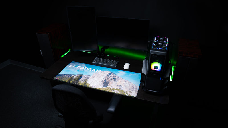 El Capitan deskmat displayed in a premium gaming workstation, featuring Yosemite National Park's iconic granite monolith, vibrant HD photography, and premium stitched edges.
