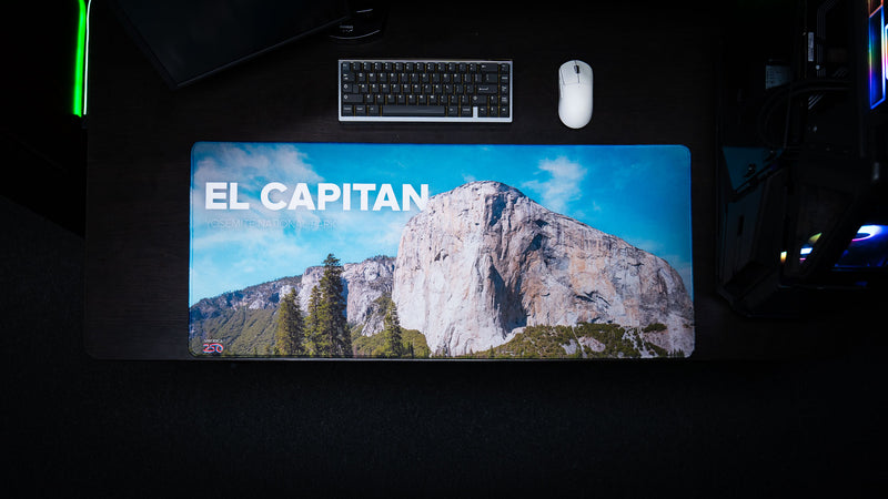 Top-down view of the El Capitan deskmat featuring Yosemite National Park's iconic granite monolith, vibrant HD photography, premium stitched edges