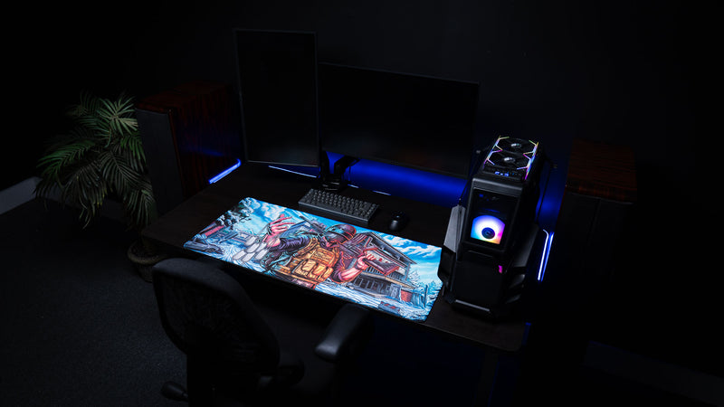 Full gaming desk setup featuring the Extraction Boss deskmat by ImOw with dual monitors, RGB PC, mechanical keyboard, and premium oversized stitched-edge deskmat.