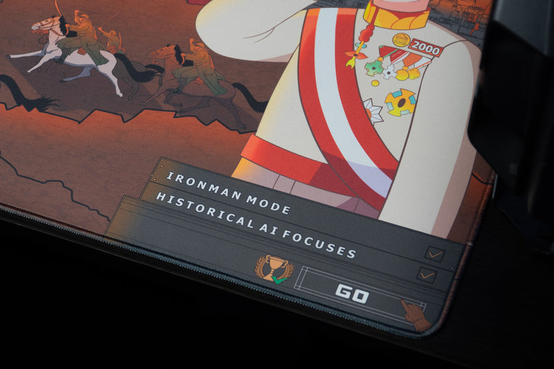 Close-up of Chaotic Dawn deskmat showing the commander's medals and the Ironman Mode, Historical AI Focuses, and Go artwork.