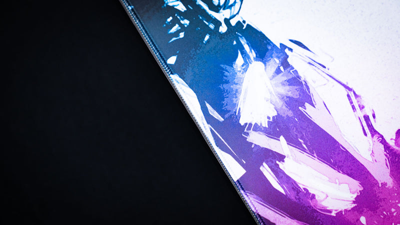 Close-up of the Forbidden Spoils deskmat highlighting the vibrant purple crystal artwork, stitched edge, and premium cloth surface.