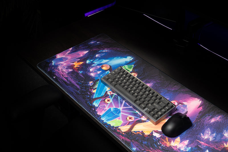 GHOSTYMPA's Perplexray's Paradise deskmat displaying colorful crystal cave artwork in a dark gaming setup.