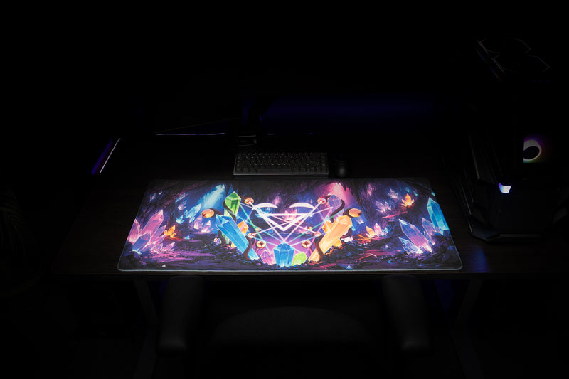 Close-up of GHOSTYMPA's Perplexray's Paradise deskmat rolled to show its stitched edges and black underside.